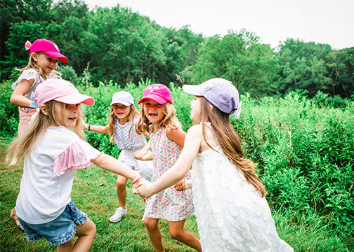 girls wearing bow baseball hats and sun hats for girls