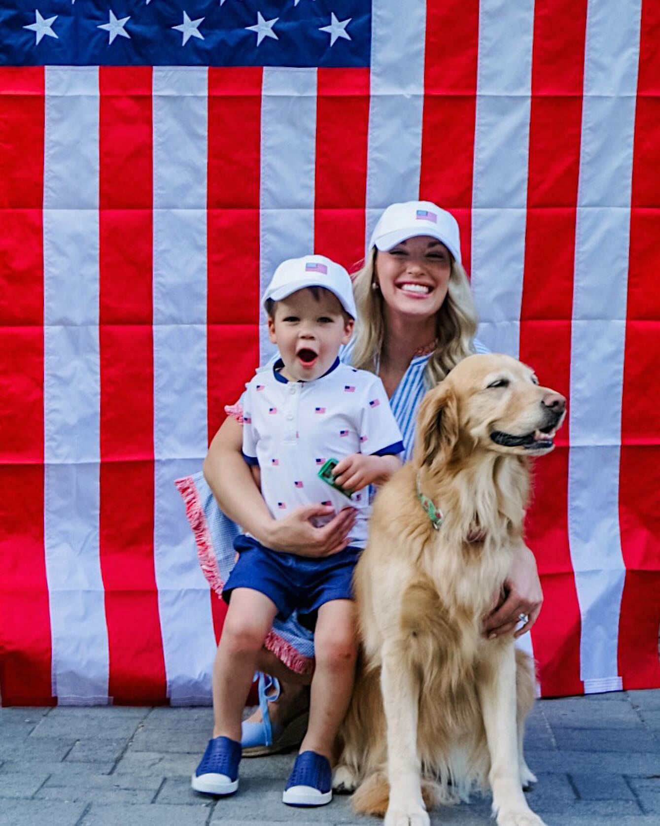 Mom and son wearing matching baseball hat with American flag embroidery