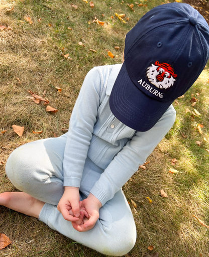 Little boy wearing Auburn Tigers baseball hat 