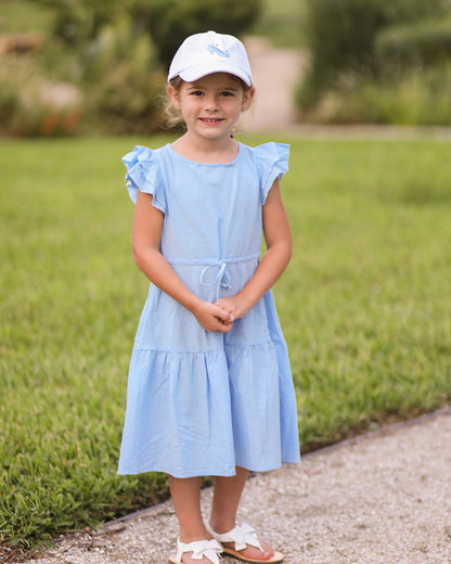 Little girl wearing a white baseball hat with glass slipper embroidery