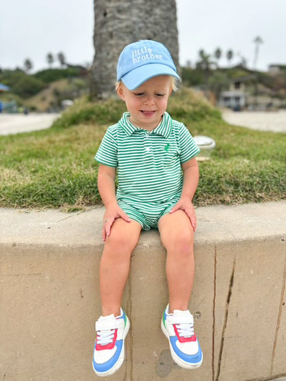 Little boy wearing blue baseball hat with little brother embroidery