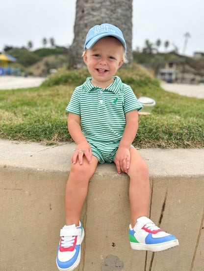 Little boy wearing blue baseball hat with little brother embroidery