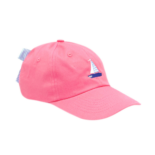 Coral baseball hat with sailboat embroidery and a bow on the back