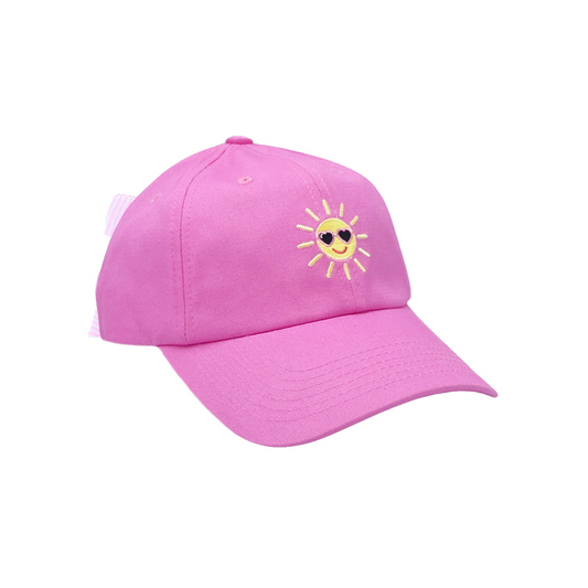 Pink baseball hat with smiley sun embroidery and a bow on the back