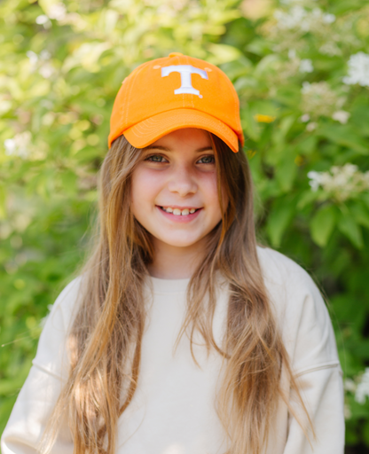 Girl wearing an orange Tennessee Vols baseball hat